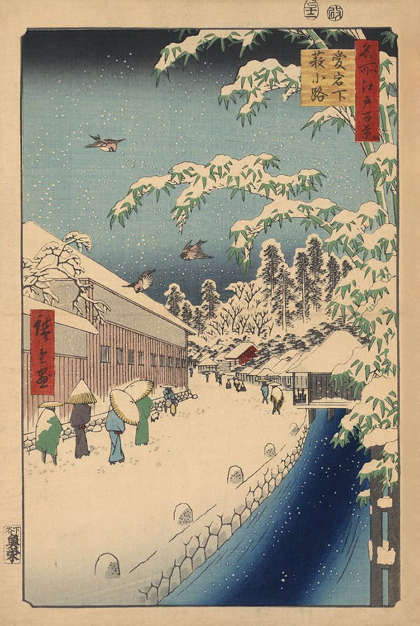 Pedestrians Walking In the Snow In a Street Alongside a Canal Below Mount Atago